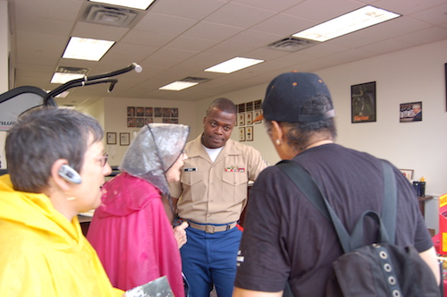 Grannies negotiating with a officer in U.S. marines recruiting center